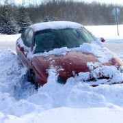 An image of a car that is covered in snow